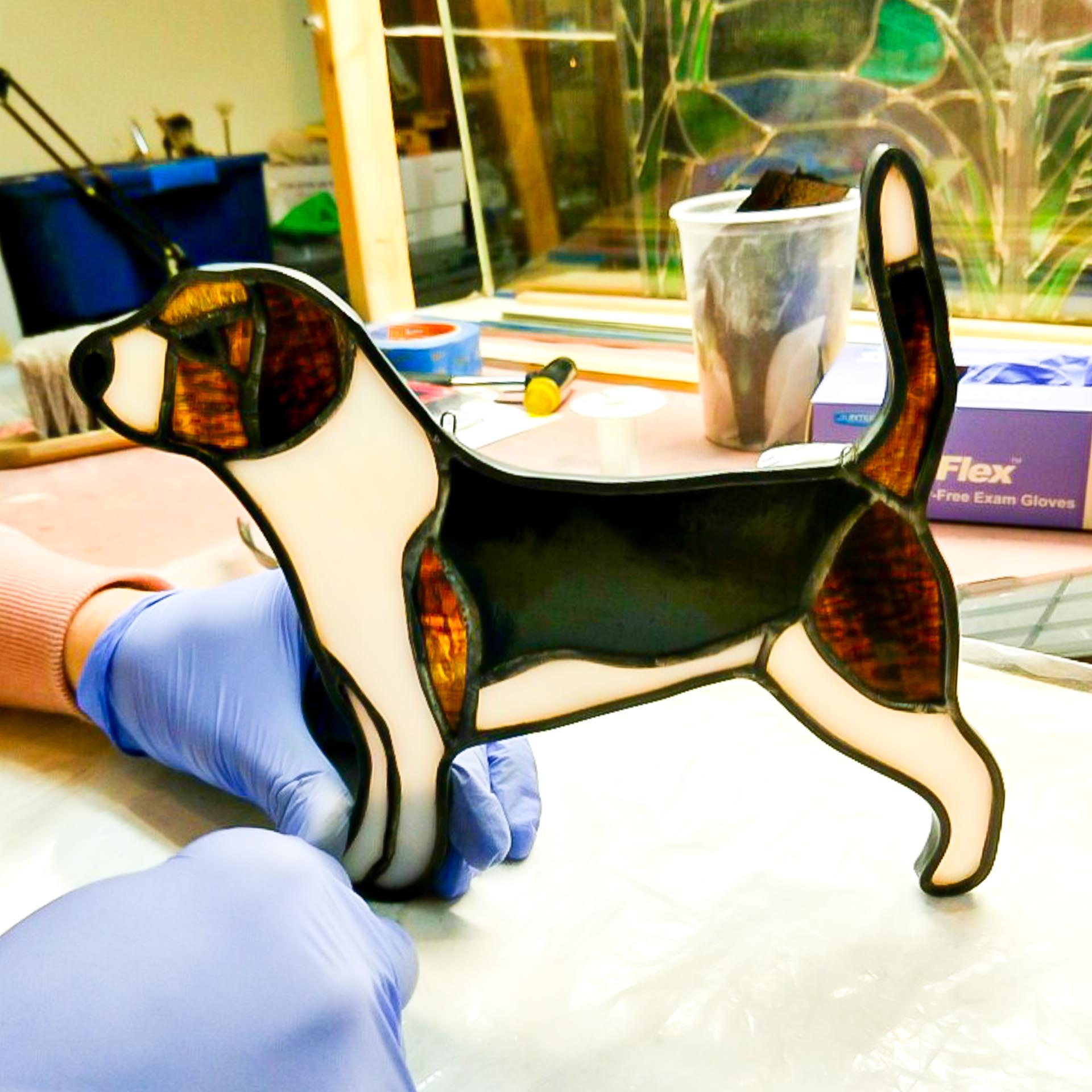 Close-up of stained glass project being assembled during an art studio workshop