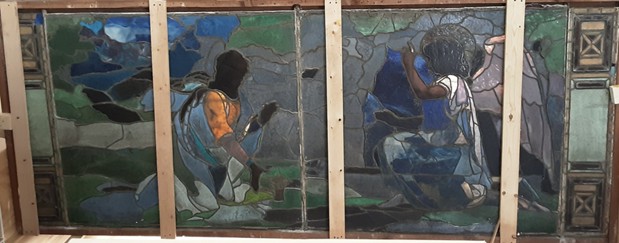 This unusual configuration suggested that the window may have been assembled from two separate compositions, with dedication panels added at a later date.