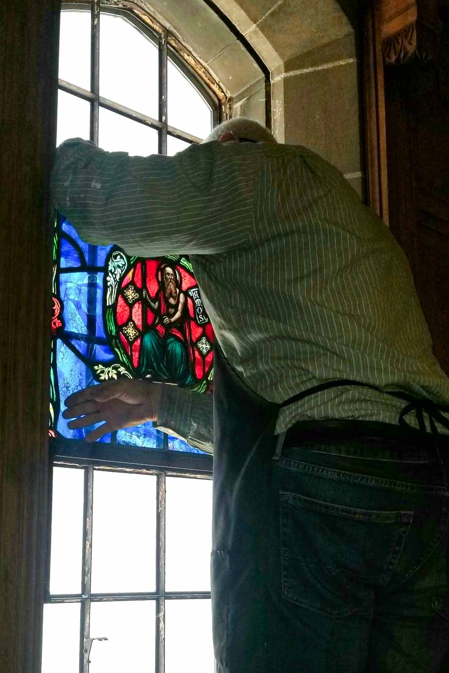 Baltic Art Studio conservator repairing a stained glass window at First Presbyterian Church of Chicago