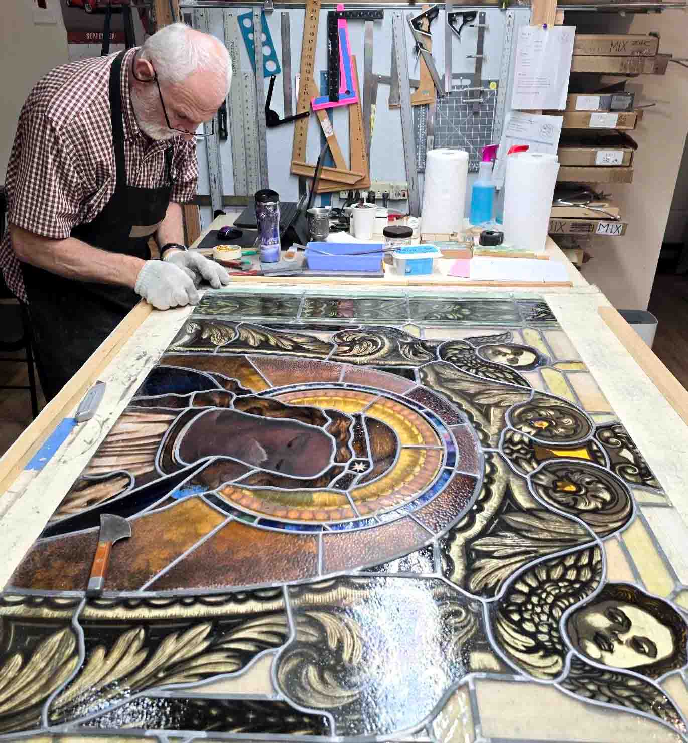 Zettler stained glass window panel during conservation treatment at St. Hyacinth Basilica