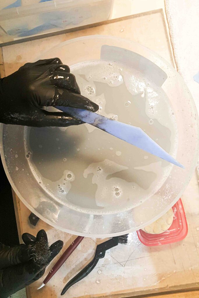 Tiffany glass piece during conservation cleaning