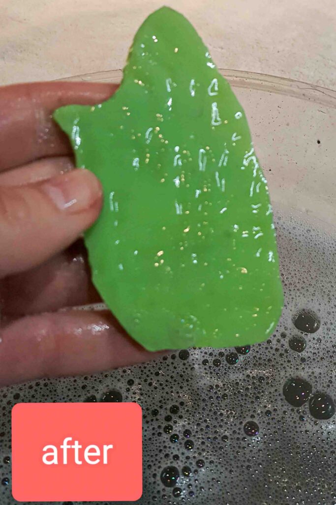 Cleaned historic green Tiffany glass piece after conservation treatment