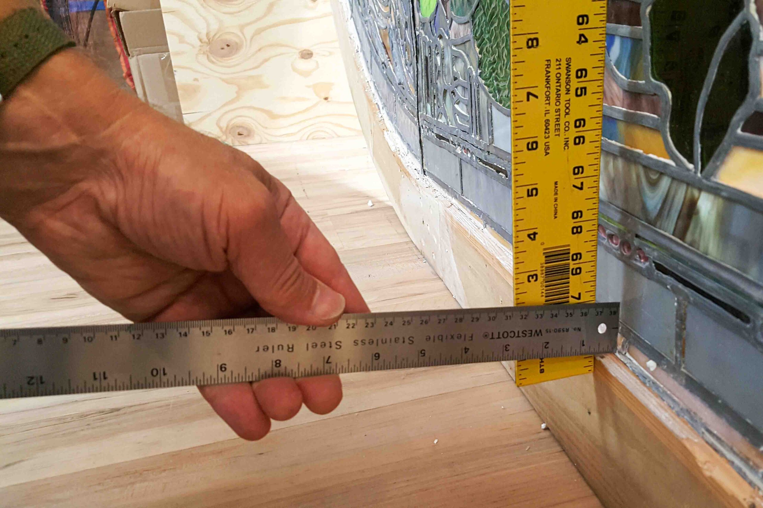 Documentation and measurement of Tiffany stained glass window before restoration